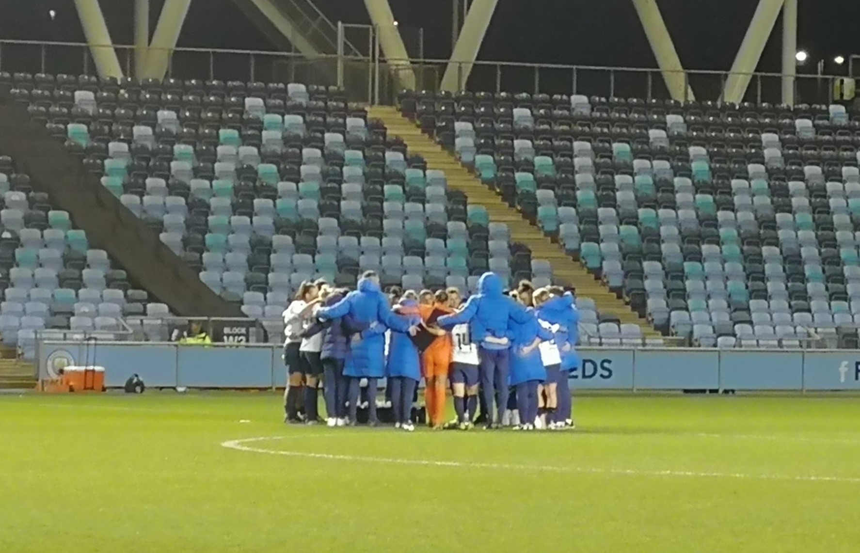 Spurs Women in a huddle following defeat in the Conti-Cup Semi-Final